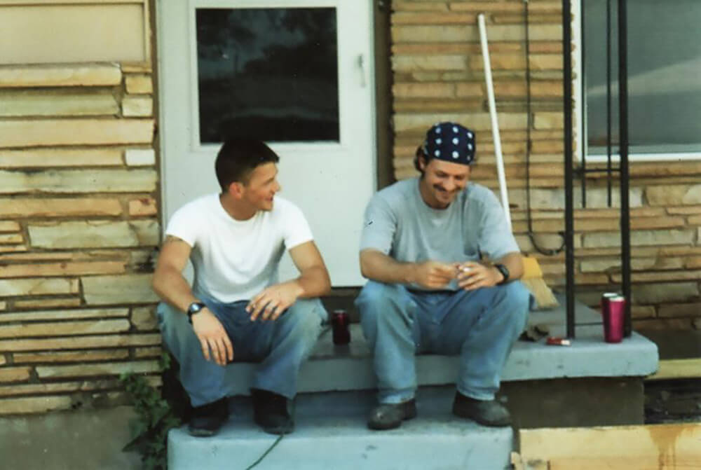 Keith with his little brother Ryan sitting on their front porch.  He was home on R&R from a 15 month deployment to Iraq